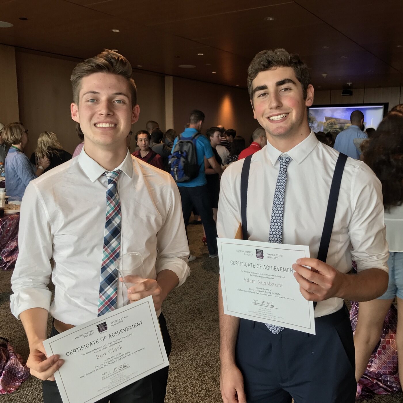 Ben and Adam holding Certificates of Achievement from the National Museum of African American History and Culture for the showing of Plessy v. Ferguson: Tipping the Scale