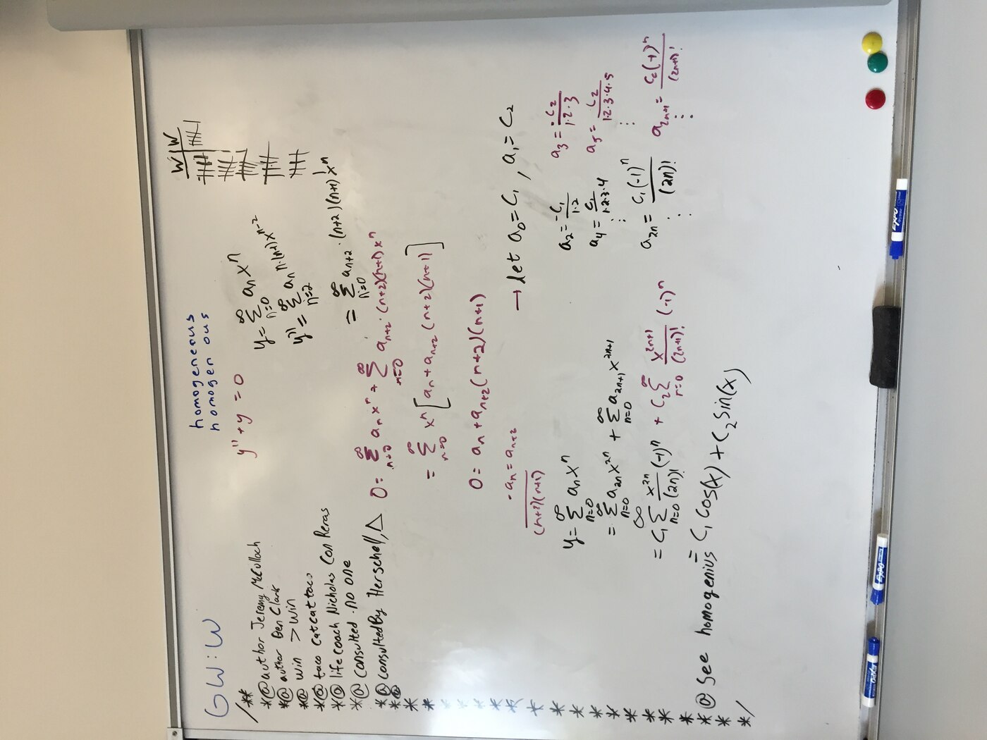 A whiteboard covered in a power-series solution to y″ + y = 0, framed inside a hand-drawn javadoc comment block listing @author Jeremy McCulloch, @author Ben Clark, @win >win, @life coach, @consulted -no one