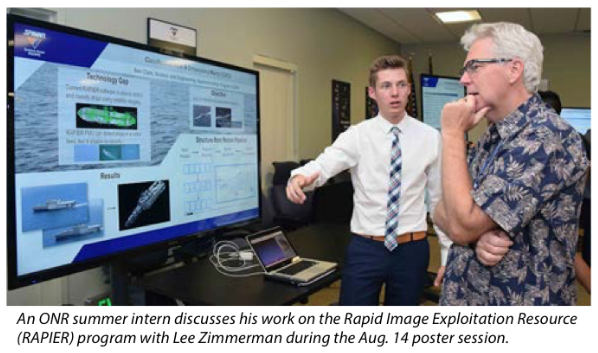 A newsletter clipping: a sixteen-year-old in a shirt and tie presents the C3PO poster on a large display to an older engineer, captioned as an ONR summer intern discussing his work on the RAPIER program during the Aug. 14 poster session